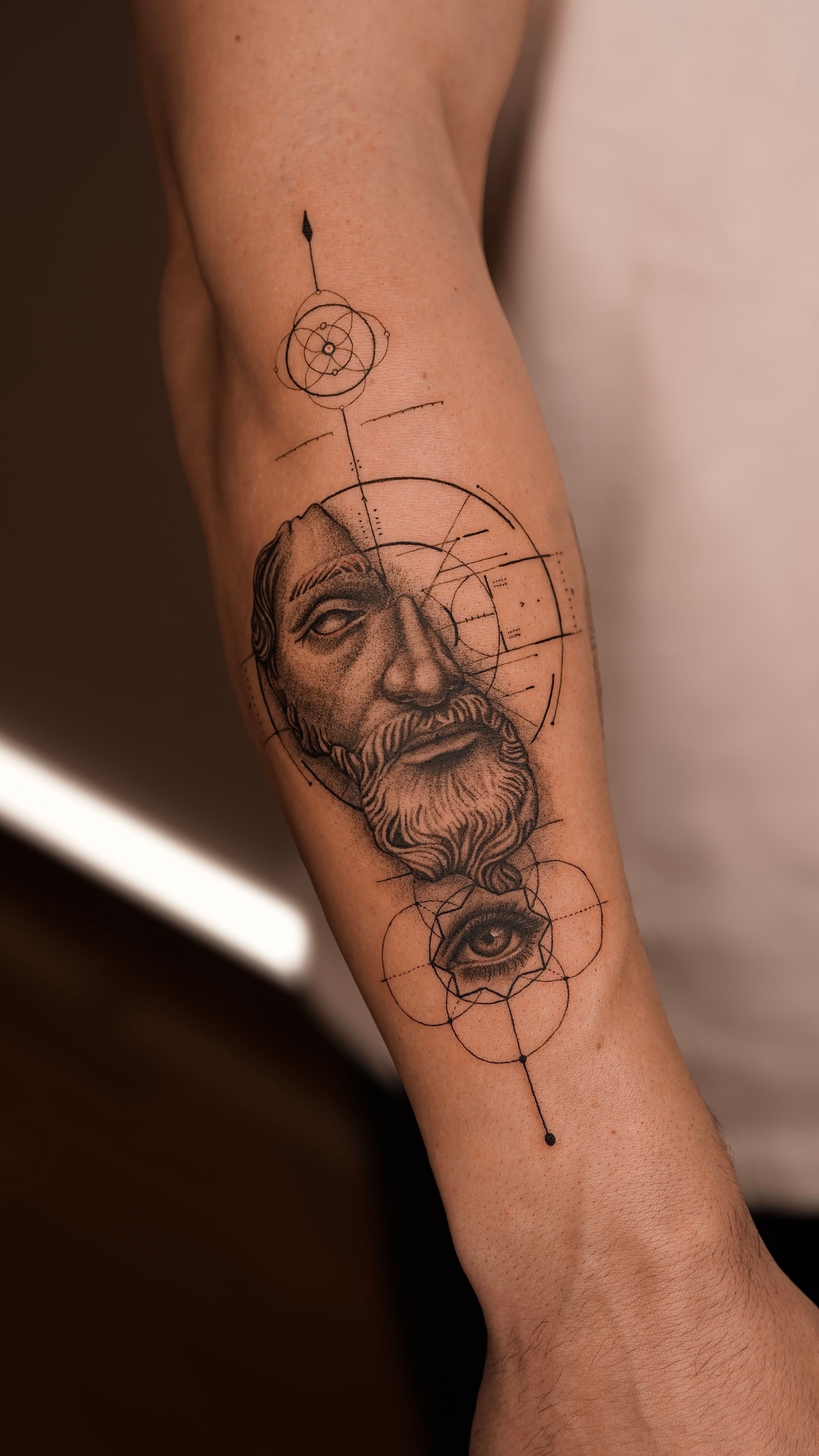 Marcus Aurelius geometric fineline tattoo demonstrating careful placement
