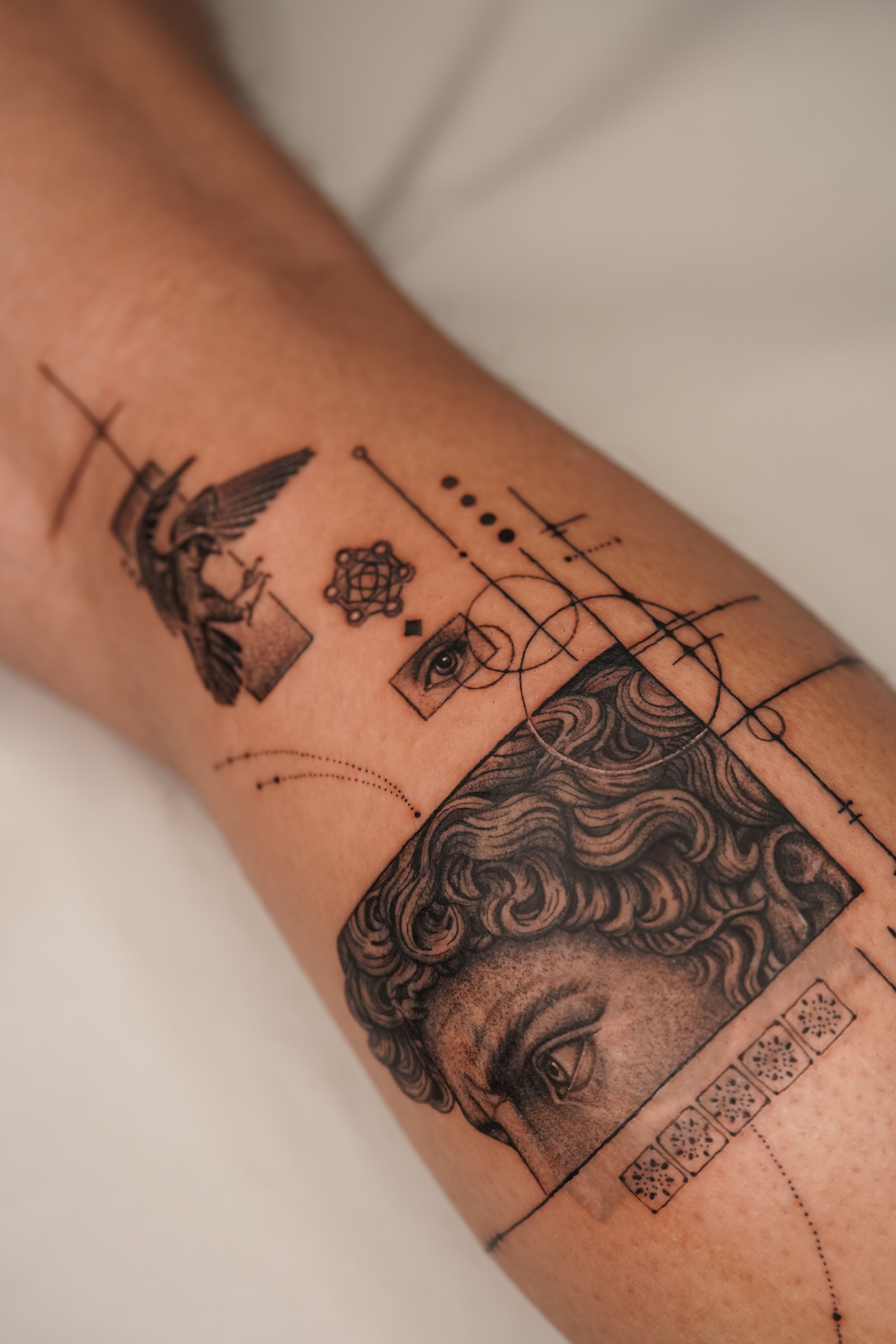 David Statue cover-up tattoo combining greek mythology imagery with fineline detail