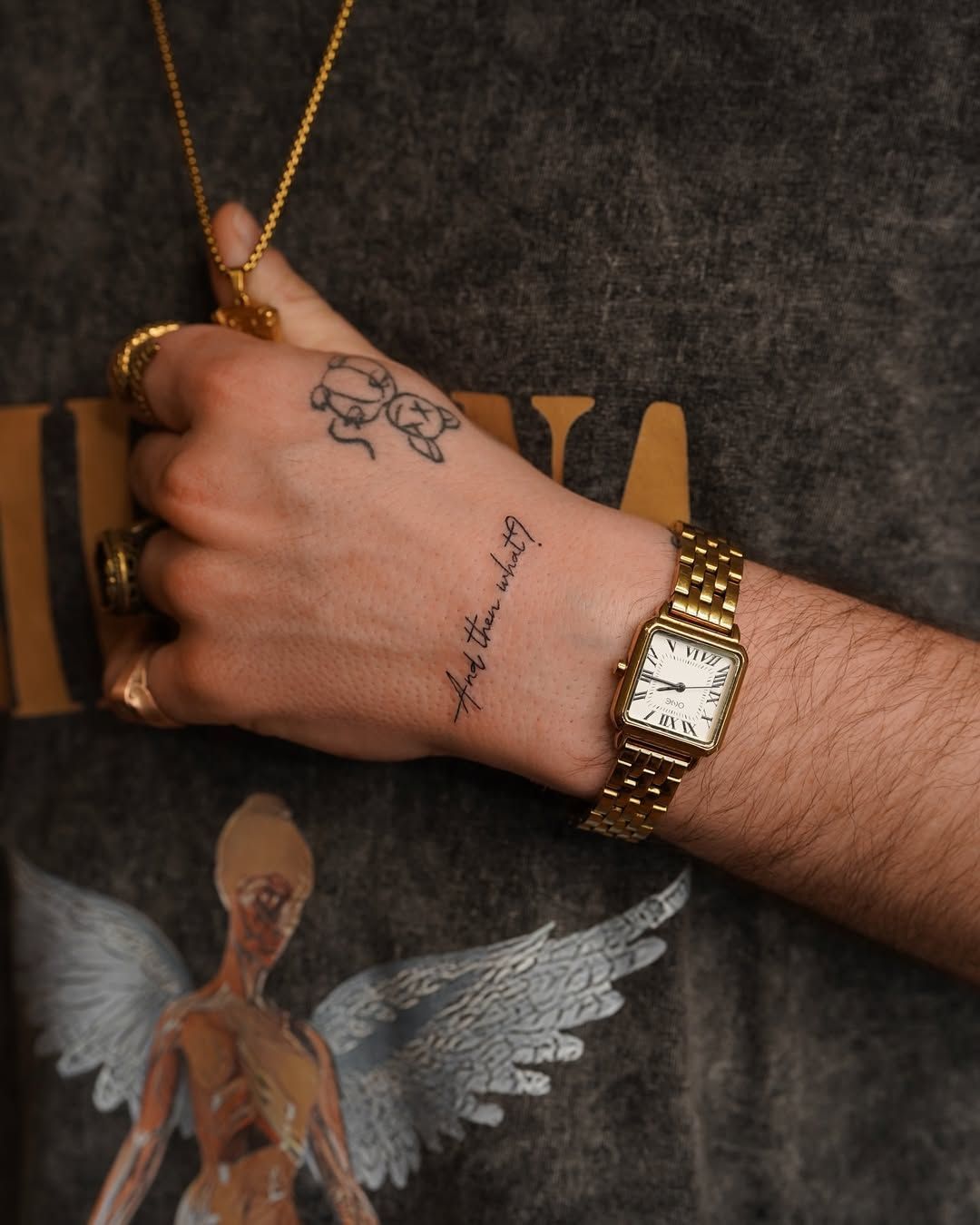 Script and floral hand tattoos combining fine lettering with botanical elements