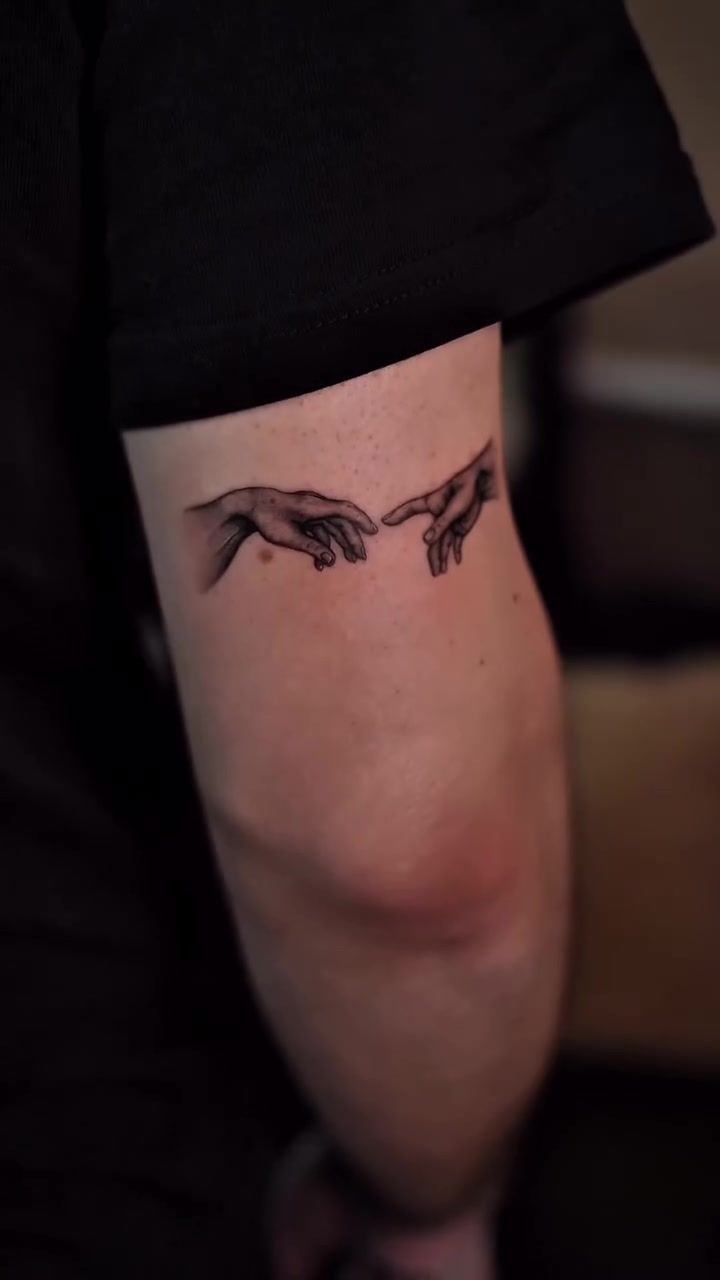 Creation of Adam micro realism arm tattoo