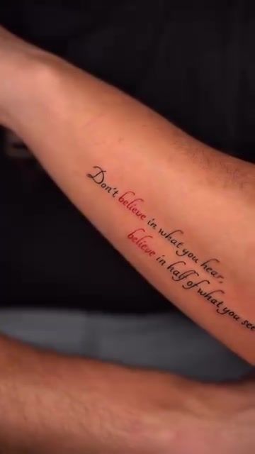 Fine script forearm tattoo reading 'Don't Believe Half of What You See' in elegant lettering