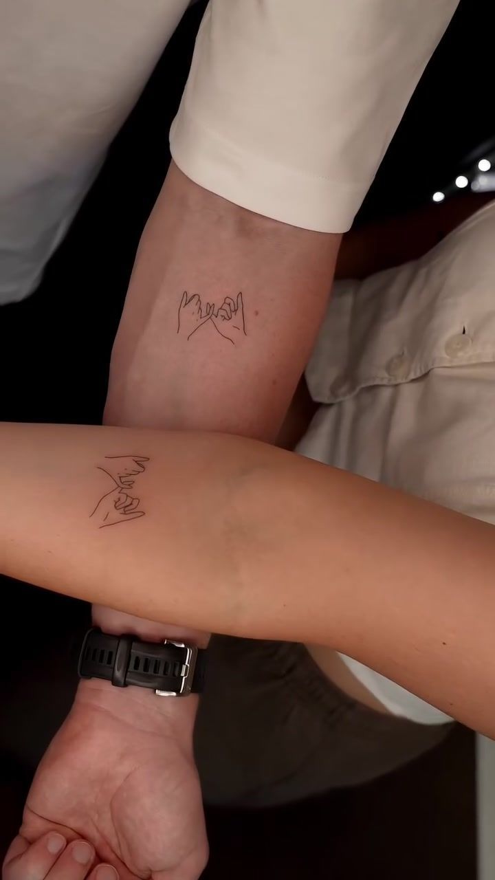 Matching pinky promise fine line tattoos. Clean minimalist single-needle linework