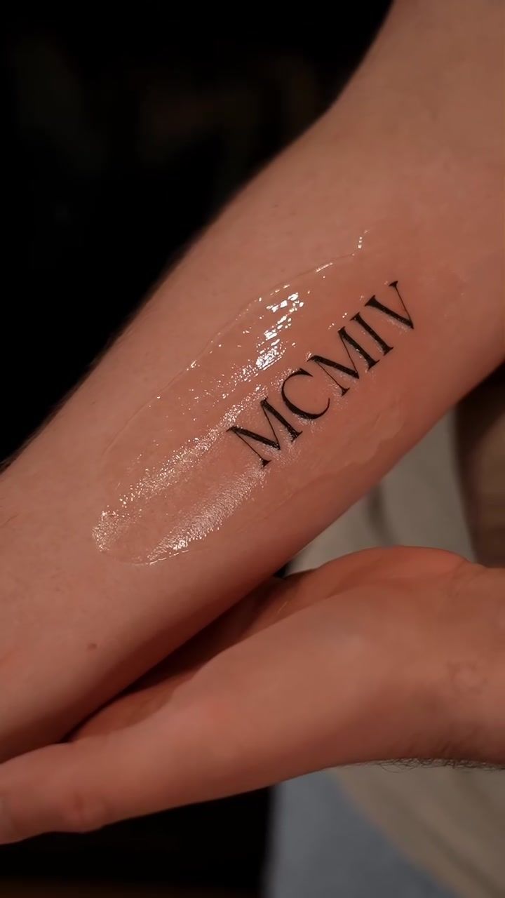 MCMIV Roman numeral lettering tattoo