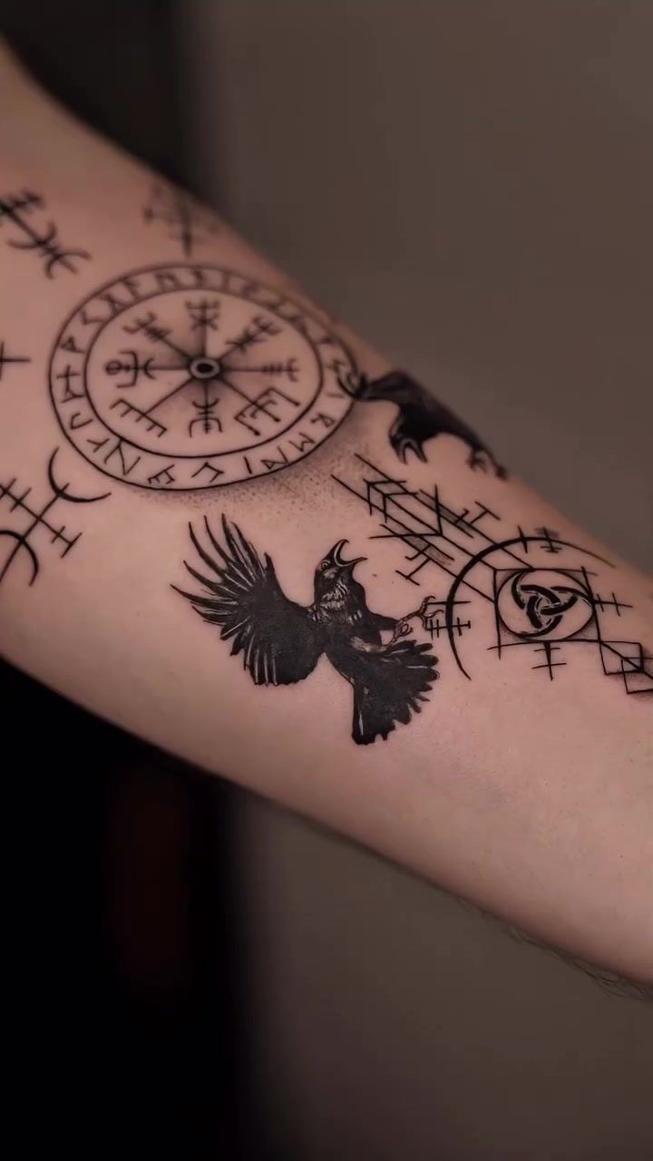 Nordic compass and ravens geometric forearm tattoo in black and grey